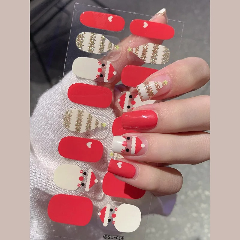 Red and Gold Glitter Snowflake Nail Strips – Semi-cured nail stickers in red and gold glitter with snowflake details for a glamorous holiday manicure.